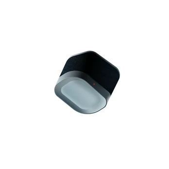 A compact black fabric-covered device rendered against white.